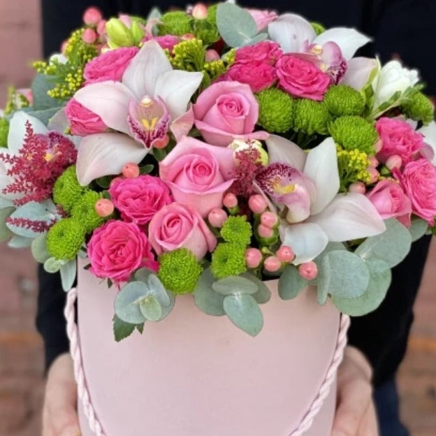 "Floral Bliss: A Vivid Mix of Roses, Orhids, and Blooms"