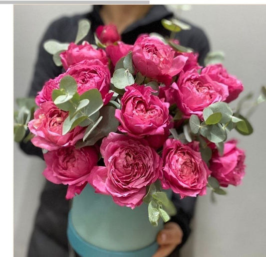 "BLOOMING ELEGANCE" This exquisite arrangement of peony-like pink roses in a box